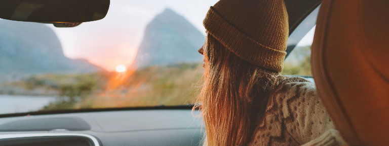 Auto_Refi_Landing Page Banner_768x290 woman looking out car windshield